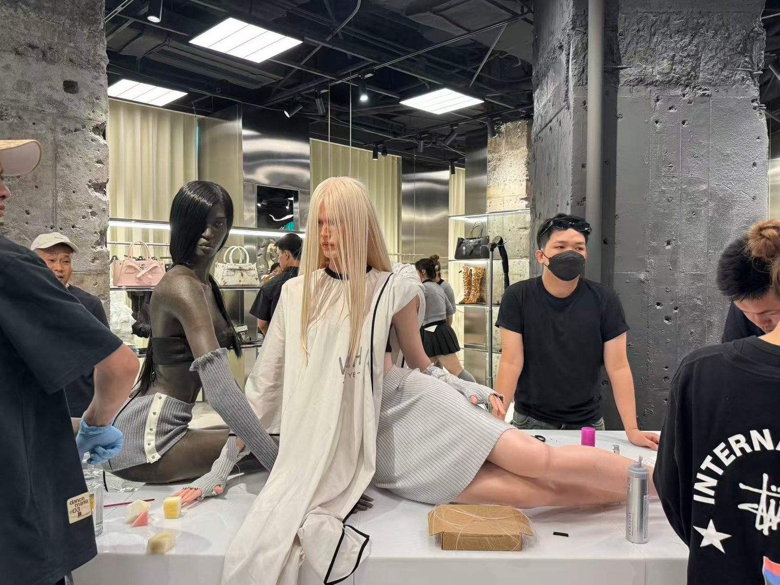 Wax figure artisans working on life-size figures in the MAI Art Culture studio