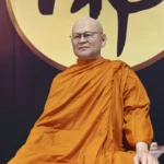 Bespoke wax portrait wearing golden monastic robes