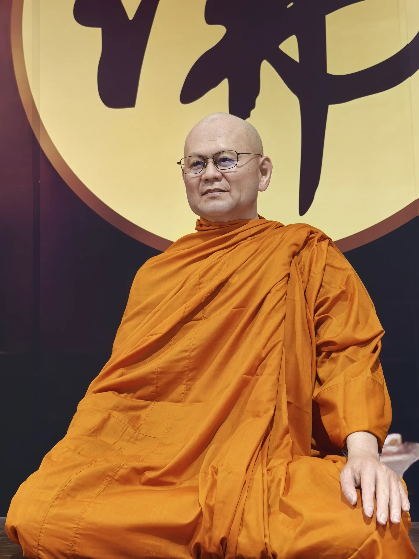 Bespoke wax portrait wearing golden monastic robes