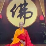 The Venerable seated wax portrait in ceremonial robes