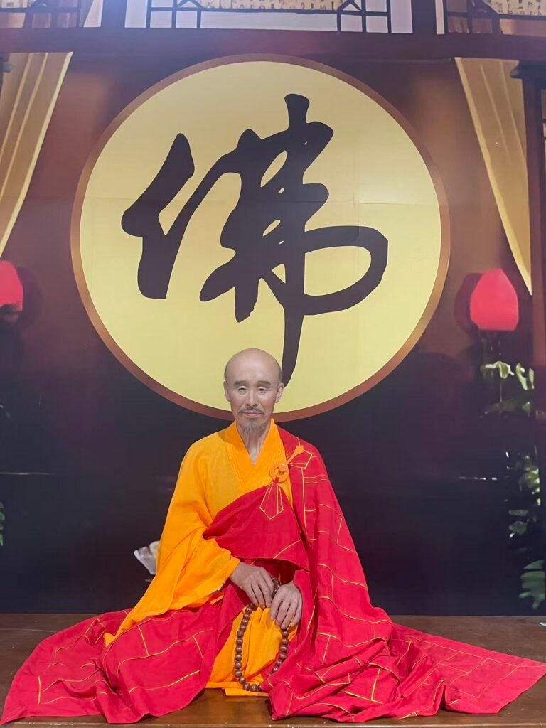 Bespoke seated Buddhist portrait before a calligraphy backdrop
